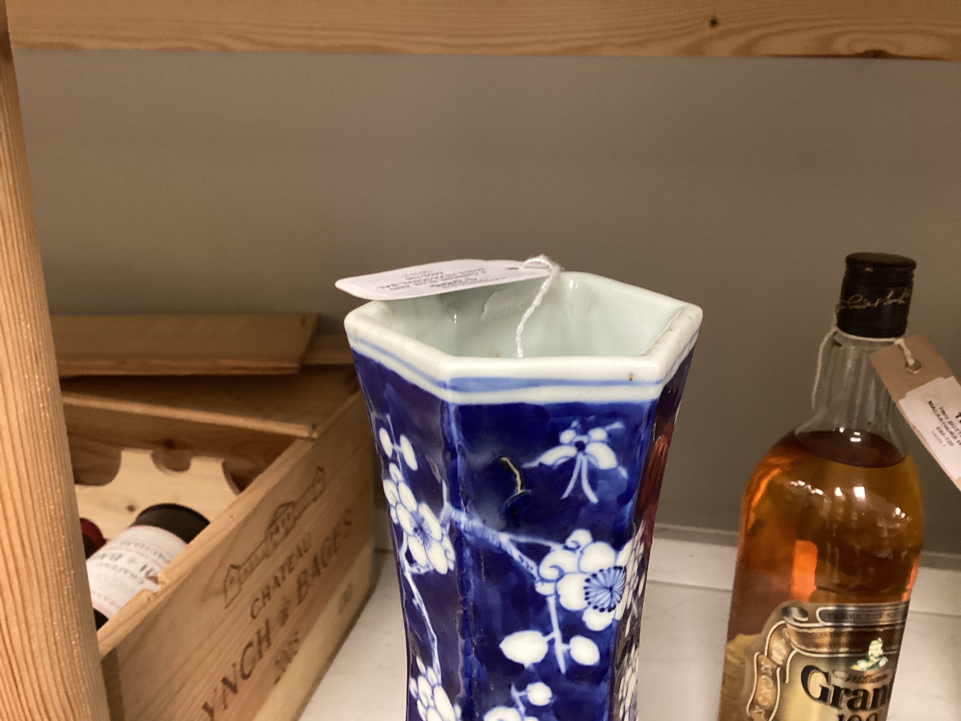 A Chinese blue and white hexagonal baluster vase, Qianlong mark, 19th century and a blue and white ‘dragon’ jar and cover, 19th century, tallest 36cm (2)